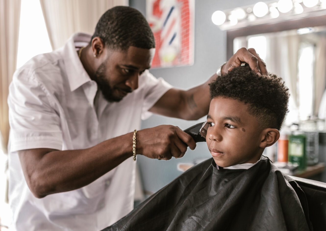 Child at barbershop getting a haircut